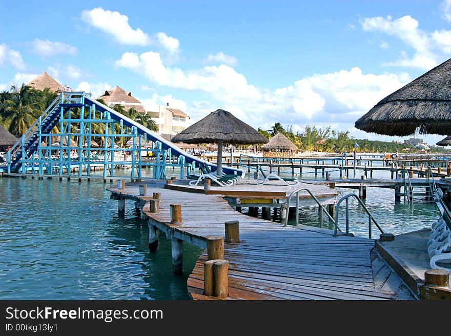 Wharf wood and umbrellas in a resort