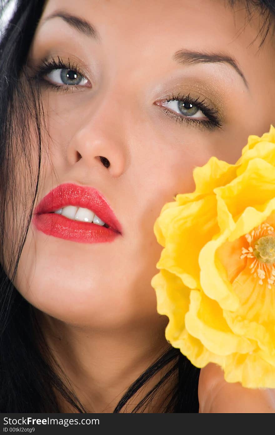 Portrait of the brunette with blue eye on white background