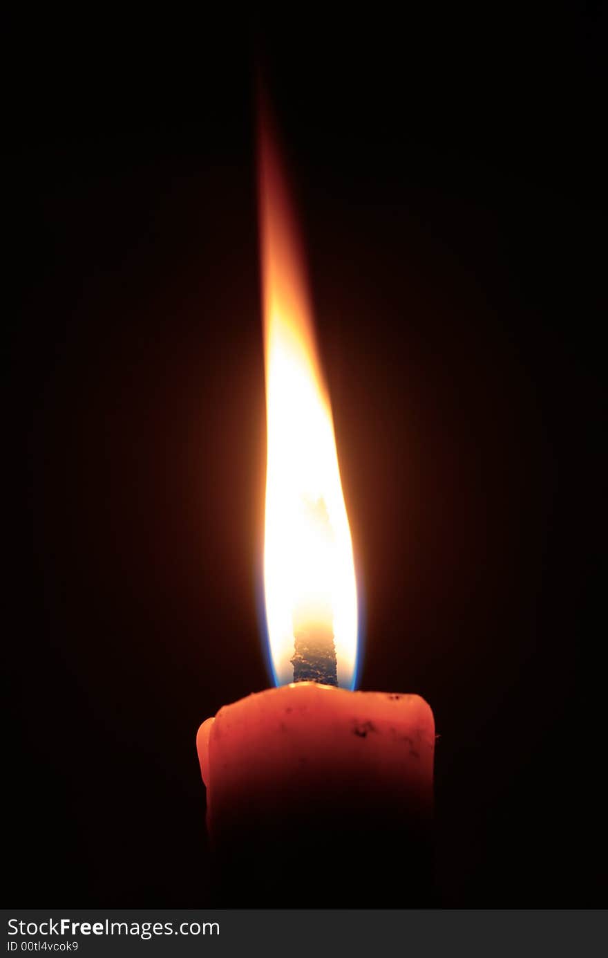 Isolated candle with black ground