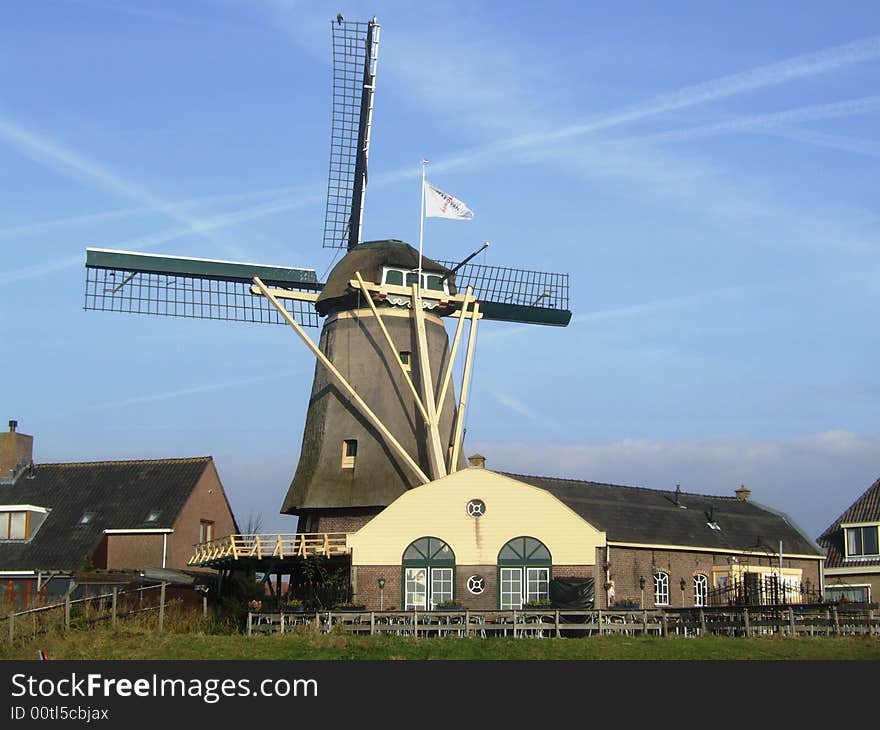 An old restored cornmill with a barn. An old restored cornmill with a barn