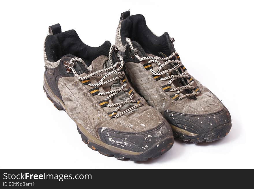 Old and dirty shoes isolated on white background