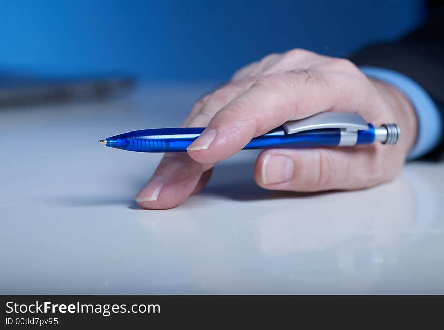 Businessman's hand with pan. Businessman's hand with pan