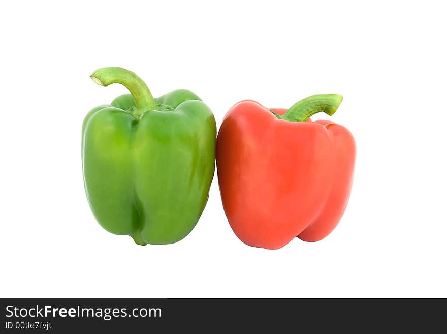 Red and green paprika on white