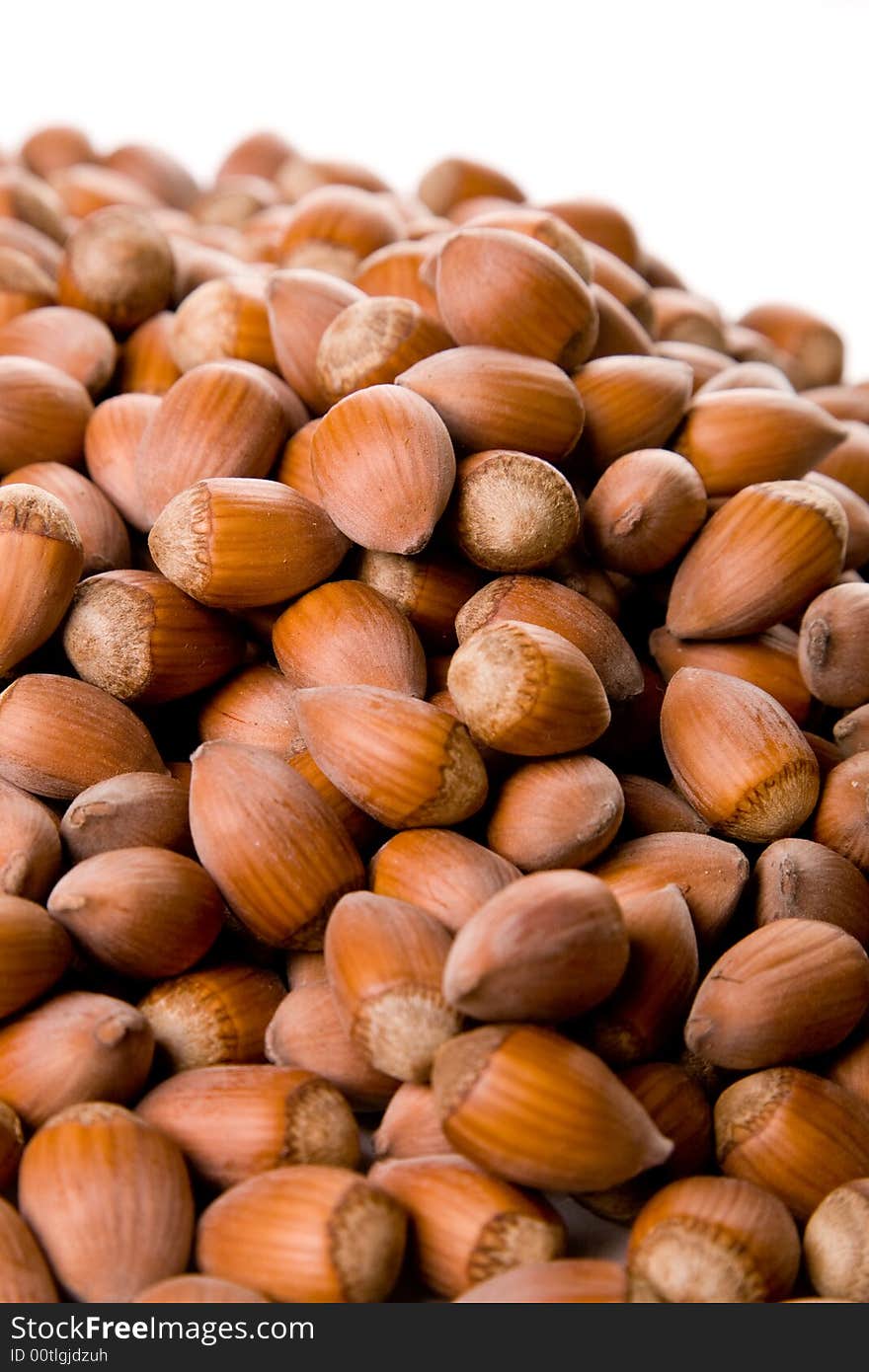 Hazelnuts against a white background