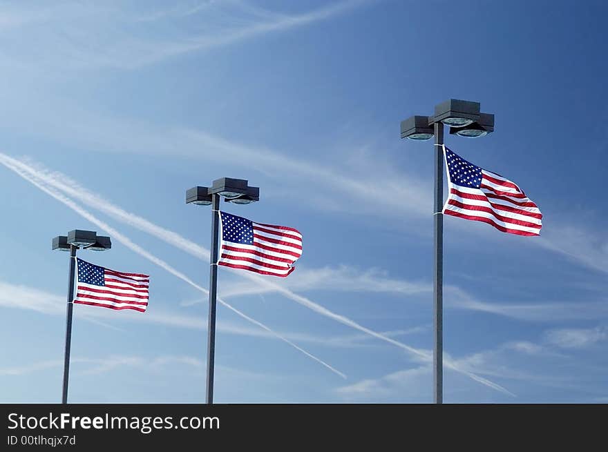 A picture of three flags taken shortly after 911 with military jets in the sky