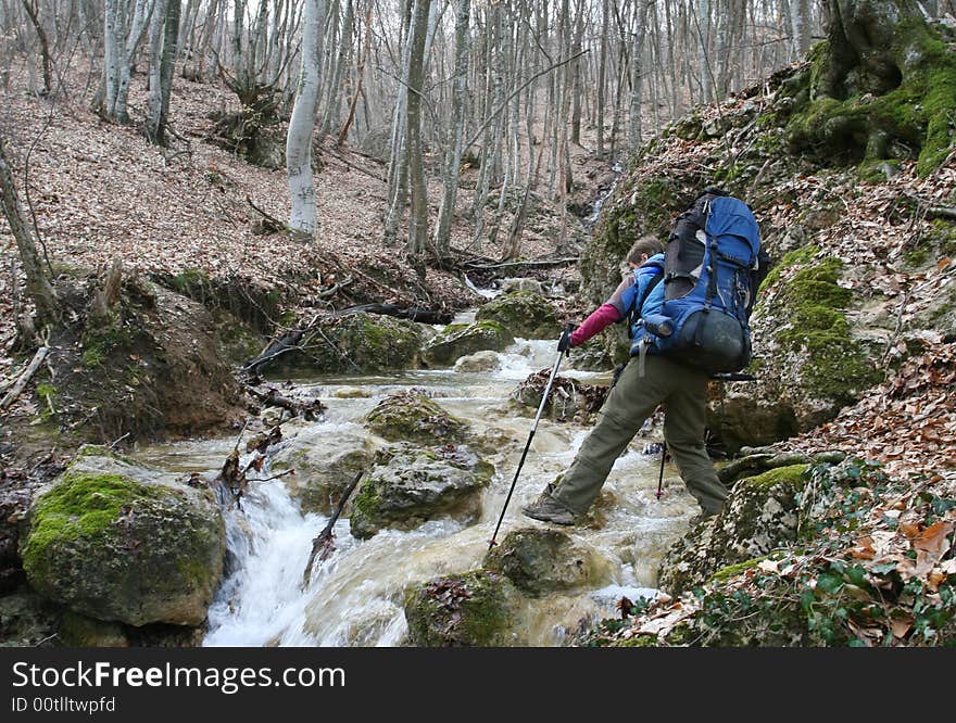 Tourists are in mountains passes the river