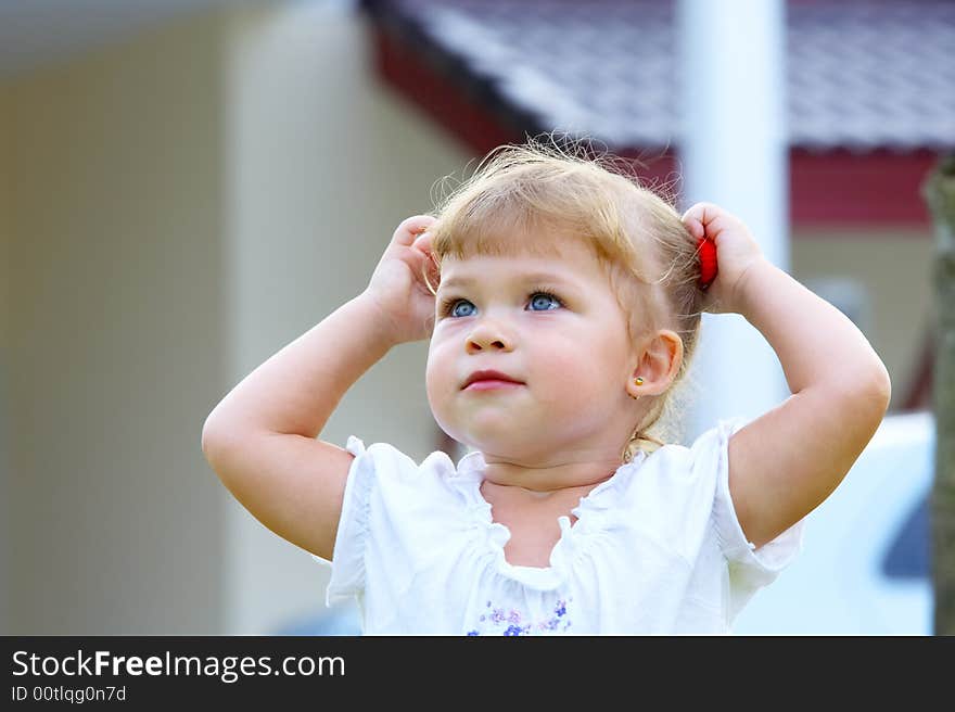 Outdoor  portrait of nice young blue eyed baby. Outdoor  portrait of nice young blue eyed baby