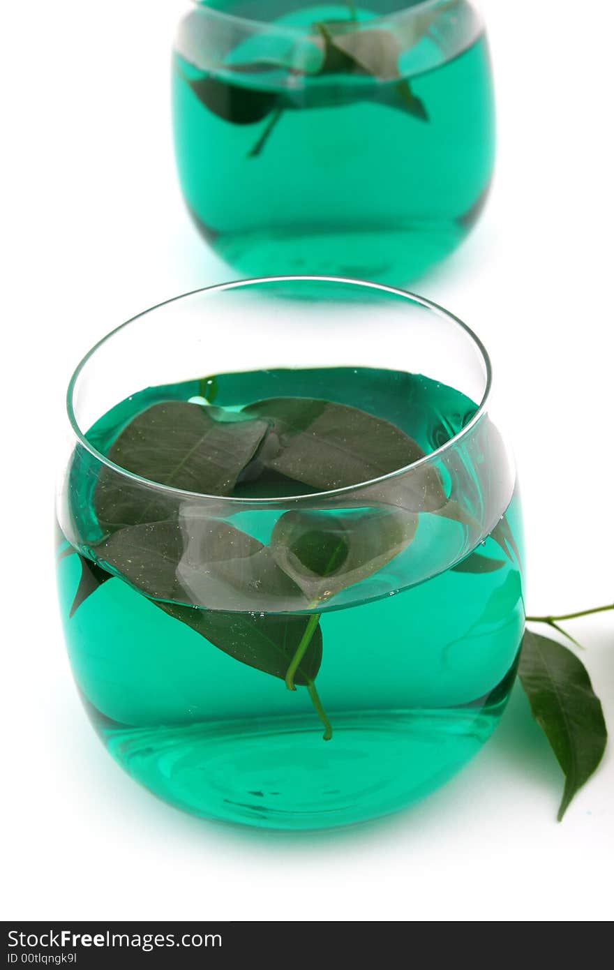 Dry leaves of green tea on white background