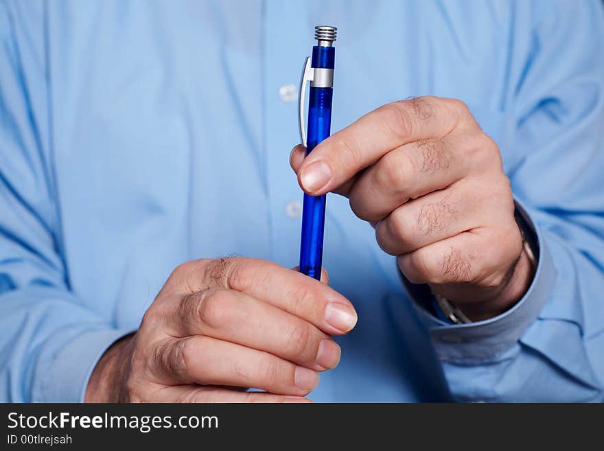 Businessman's hand with pen