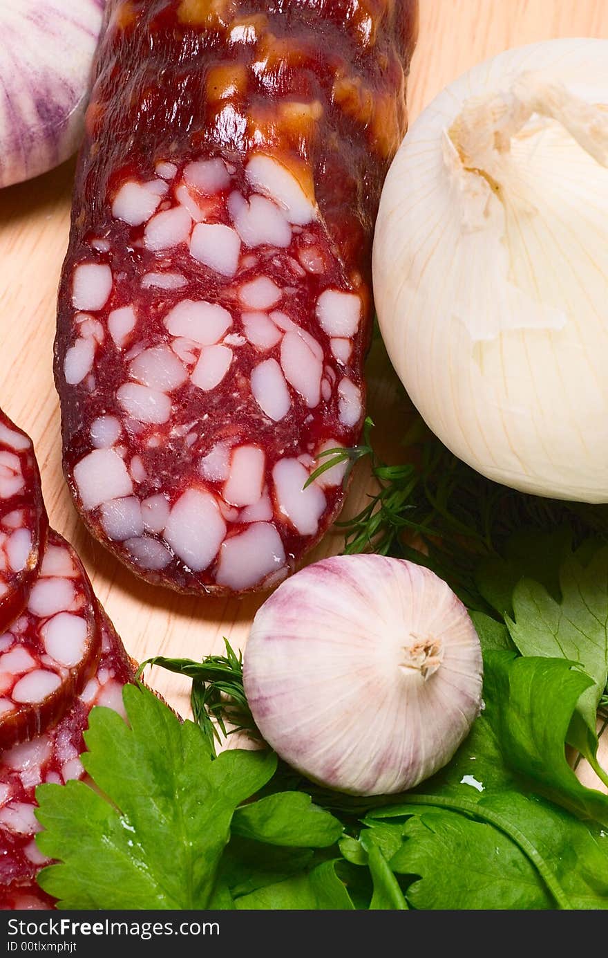 Smoked sausage, green salad, garlic, onion