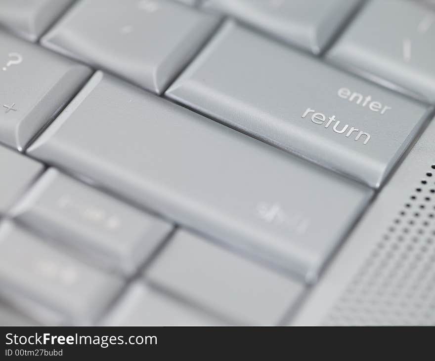 Macro Photo of a Keyboard focused on enter return key. Macro Photo of a Keyboard focused on enter return key