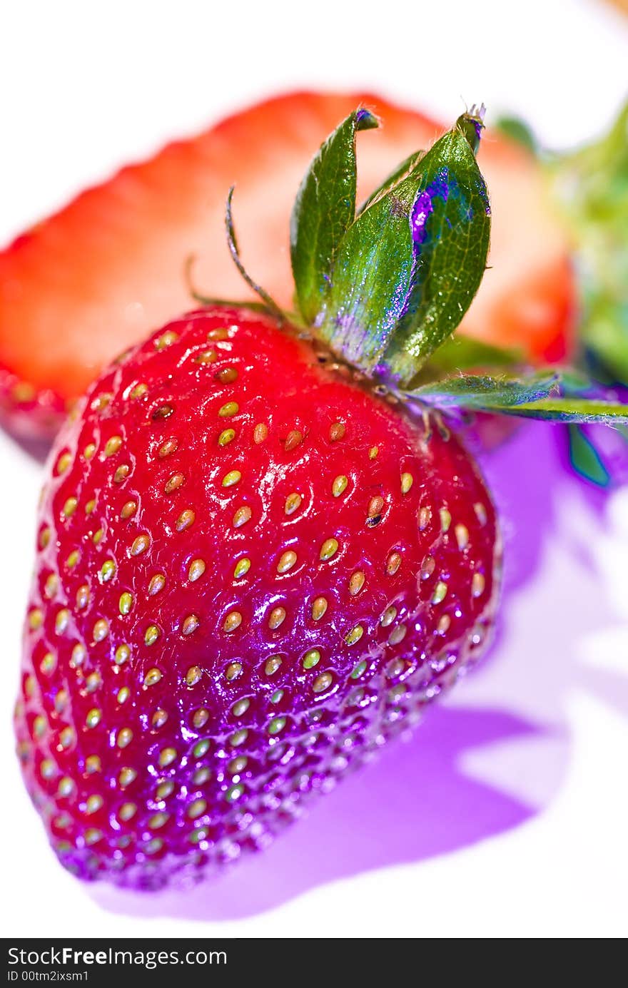 High key macro shot of ripe strawberries with funky lighting. High key macro shot of ripe strawberries with funky lighting