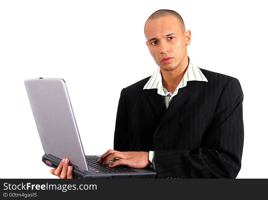 Stylish young man in suit working on his laptop. Isolated over white. Stylish young man in suit working on his laptop. Isolated over white.