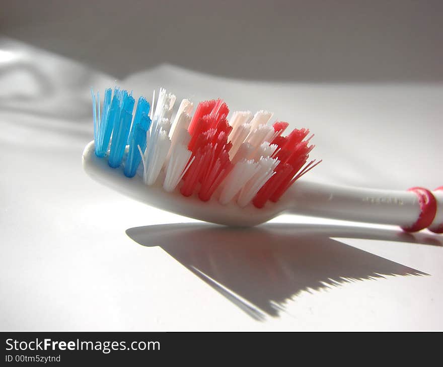 Blue red white tooth brush