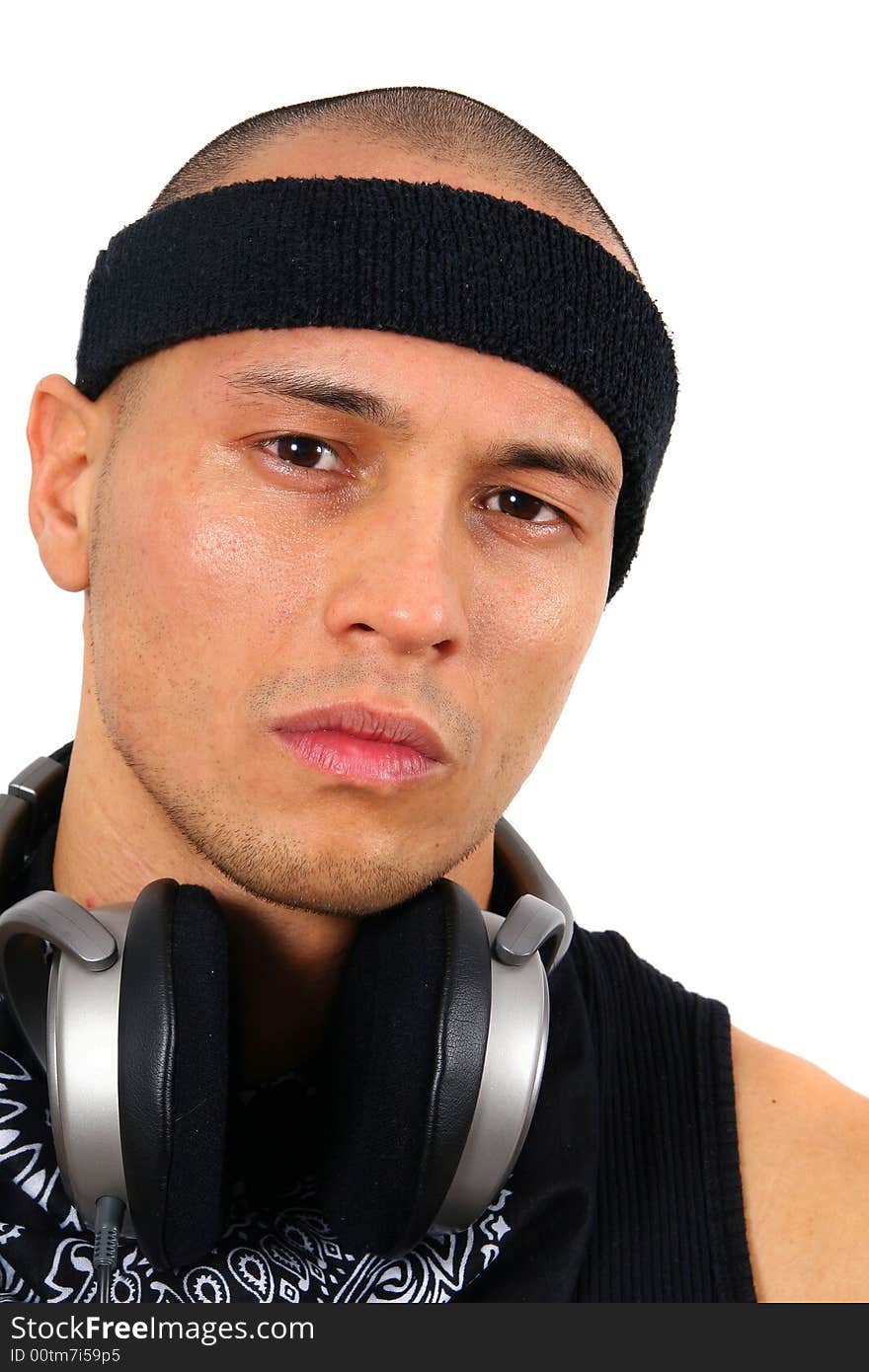 A young DJ with headphones in black. A young DJ with headphones in black.