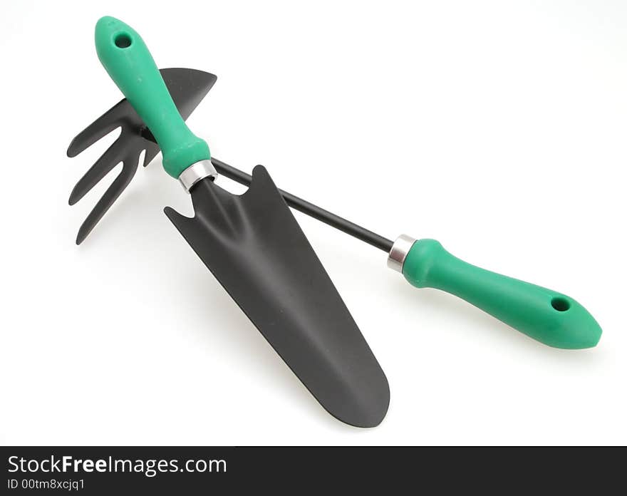 Gardening tools trowel and cultivator for planting and weeding white background. Gardening tools trowel and cultivator for planting and weeding white background