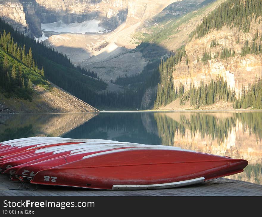 Canoes at the bottom of a mountain