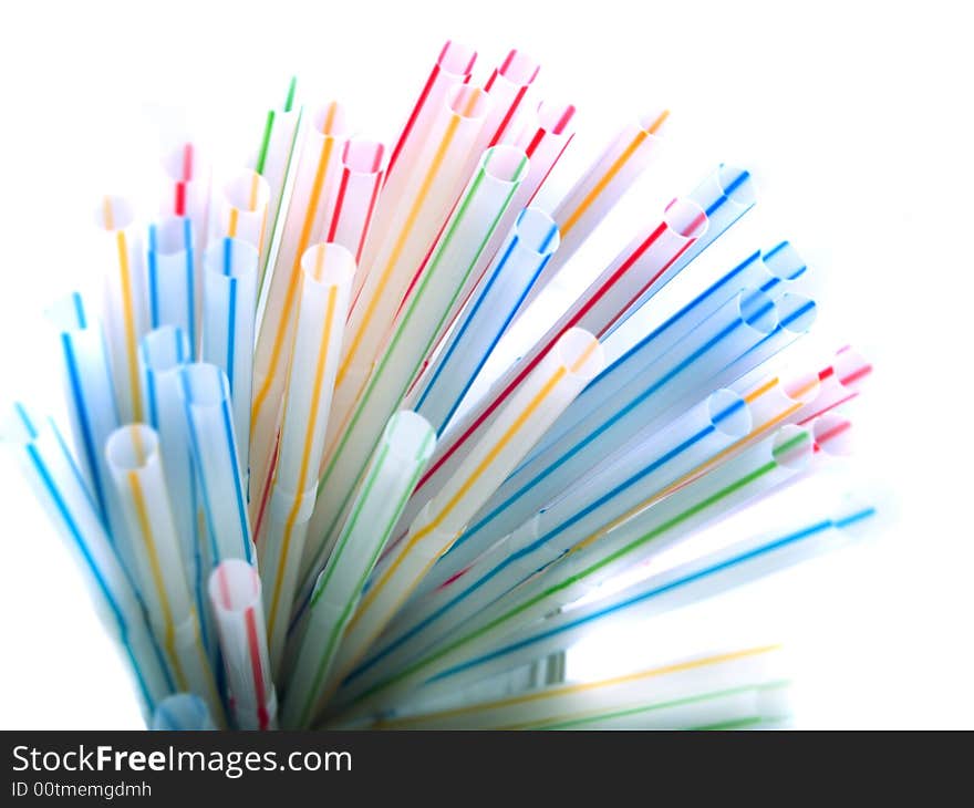 Colorful straws in a glass