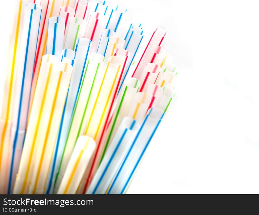 Colorful straws in a glass