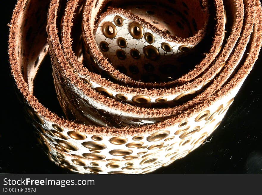 One leather, cracked, textured belt. One leather, cracked, textured belt