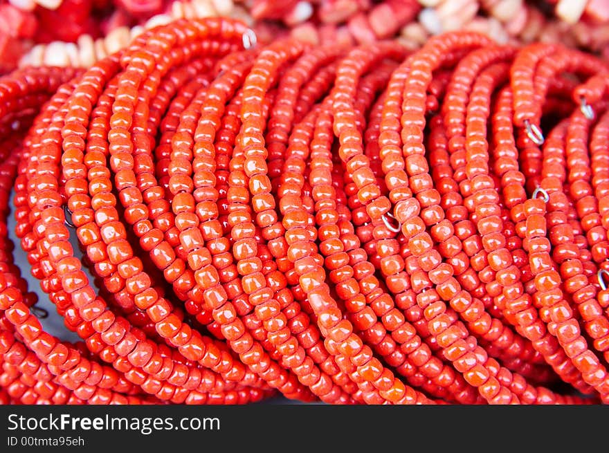 A shot of bracelet make of red beads,handmade.