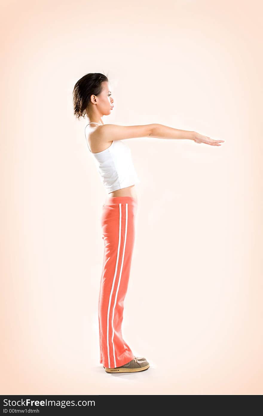 Woman doing warm up before exercise by stretching hands