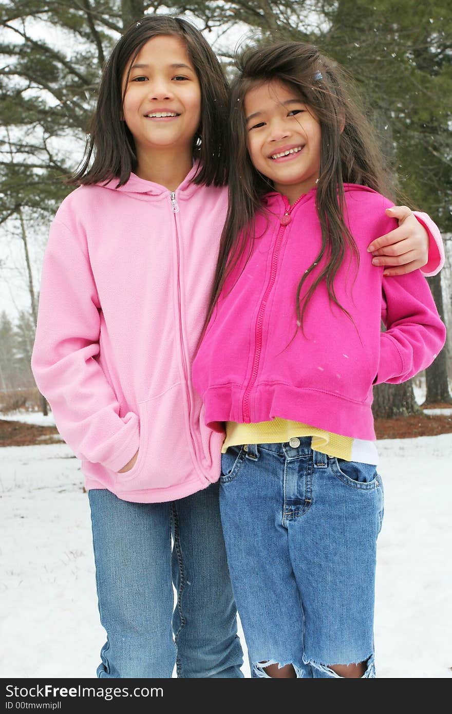 Two sisters enjoying the utdoors in winter. Two sisters enjoying the utdoors in winter