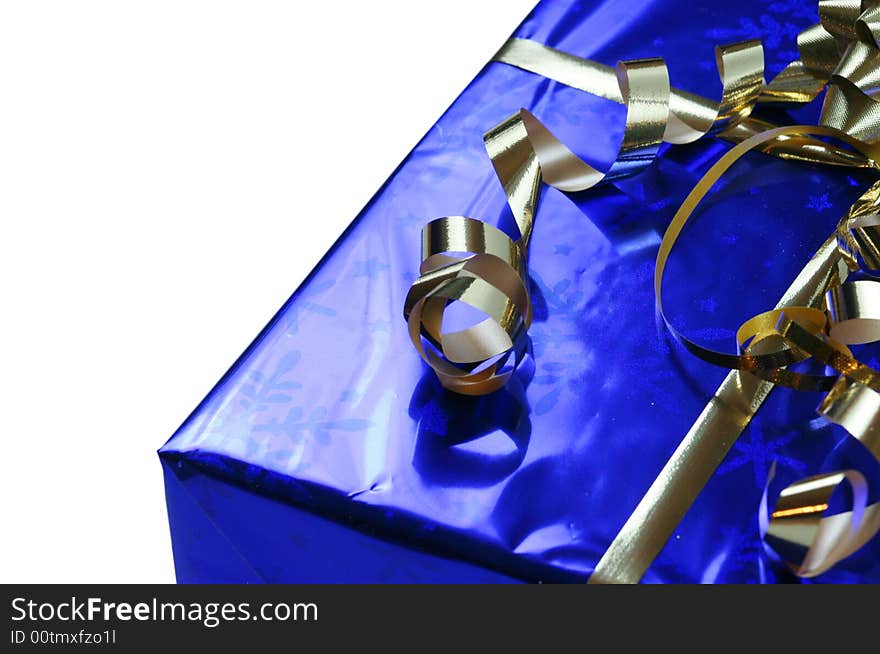 Shiny blue gift with gold ribbons