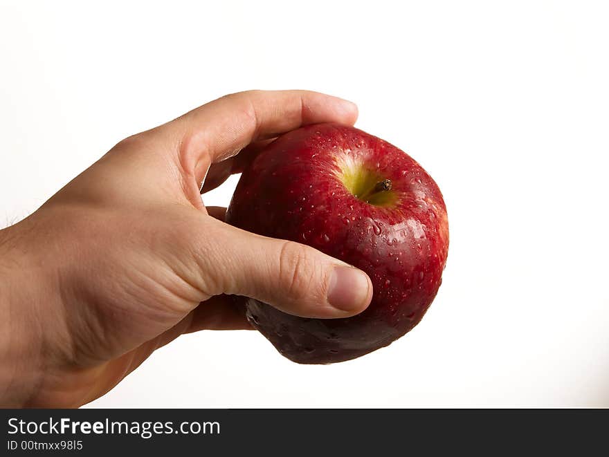 Hand holding apple