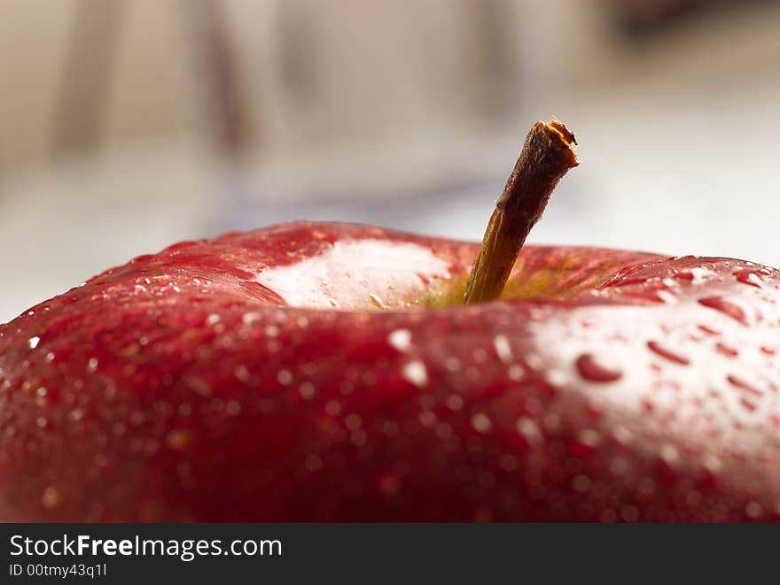 Close up red apple and stem on white isolated background. Close up red apple and stem on white isolated background.