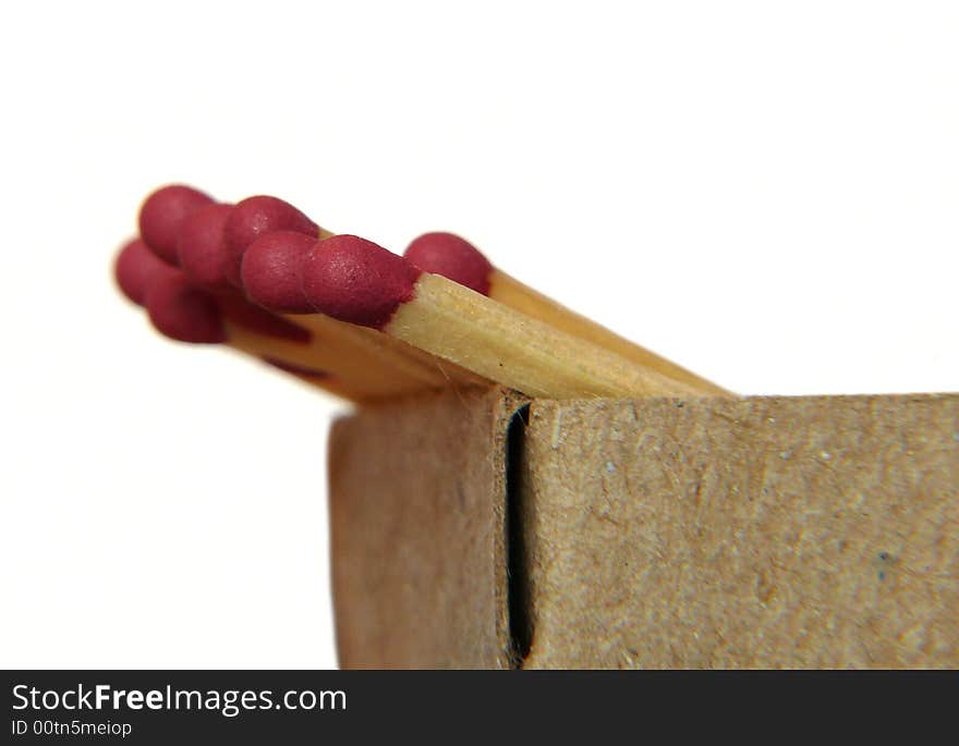 Matches in box. Extreme close-up on white background.