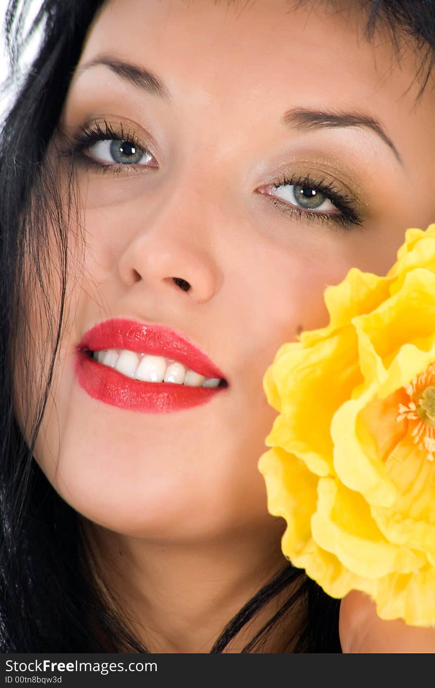 Portrait of the brunette with blue eye on white background