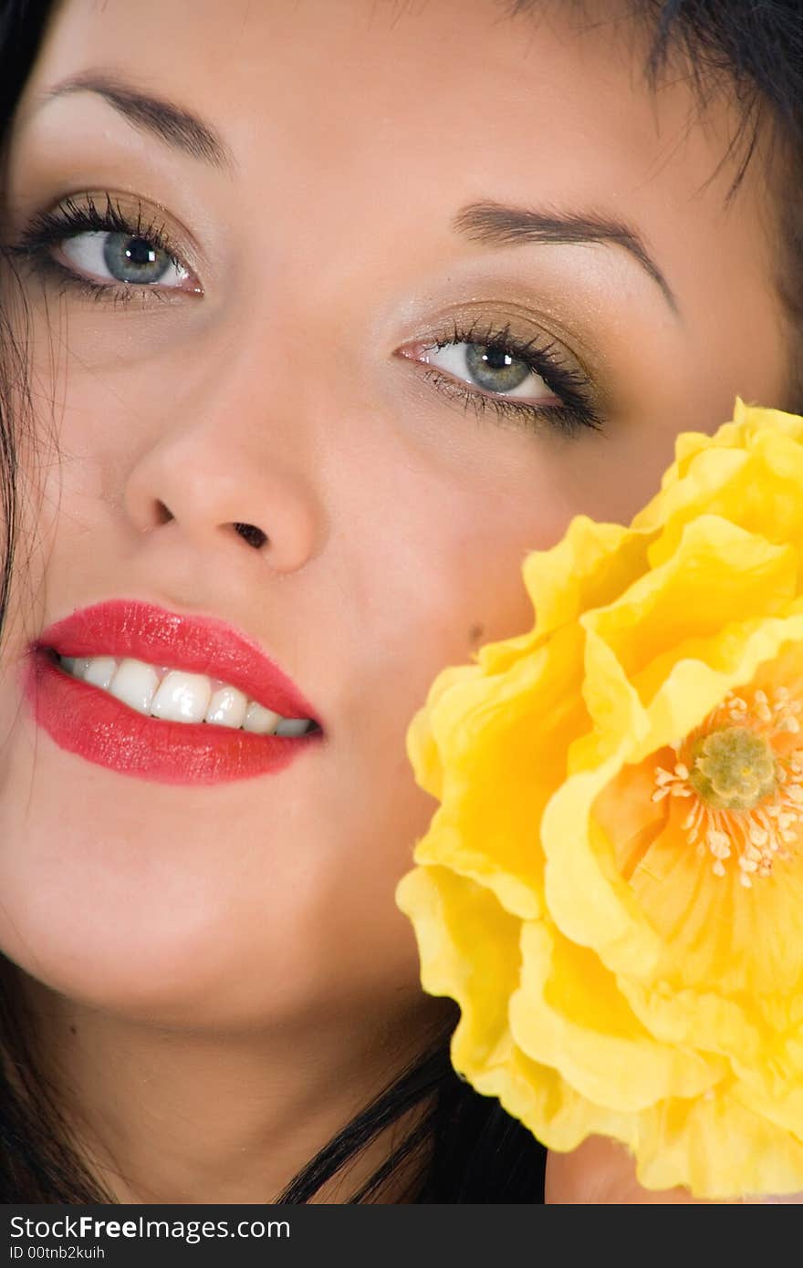 Portrait of the brunette with blue eye on white background