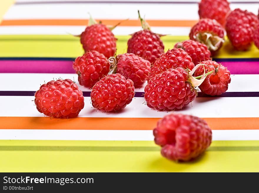 Food series: fresh red raspberry on the strip table