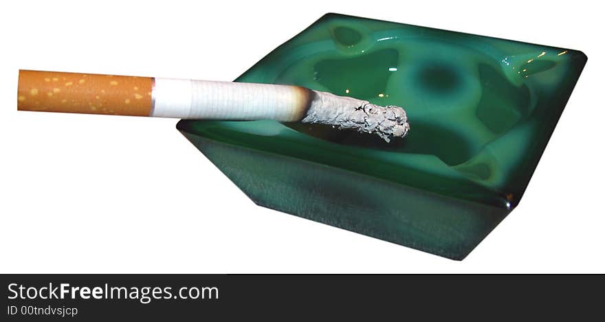 Close up of smoking cigarette in ashtray