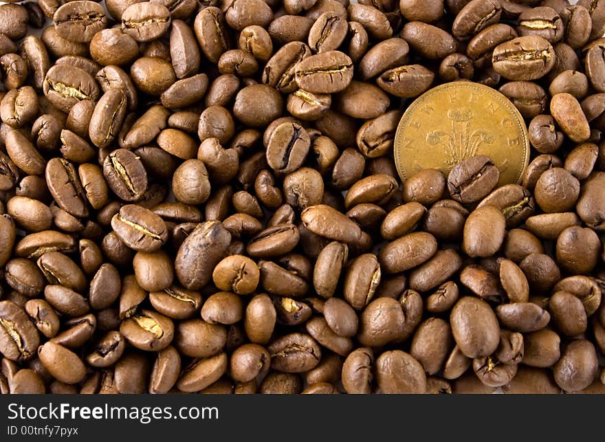 Some coffee seeds and the coin