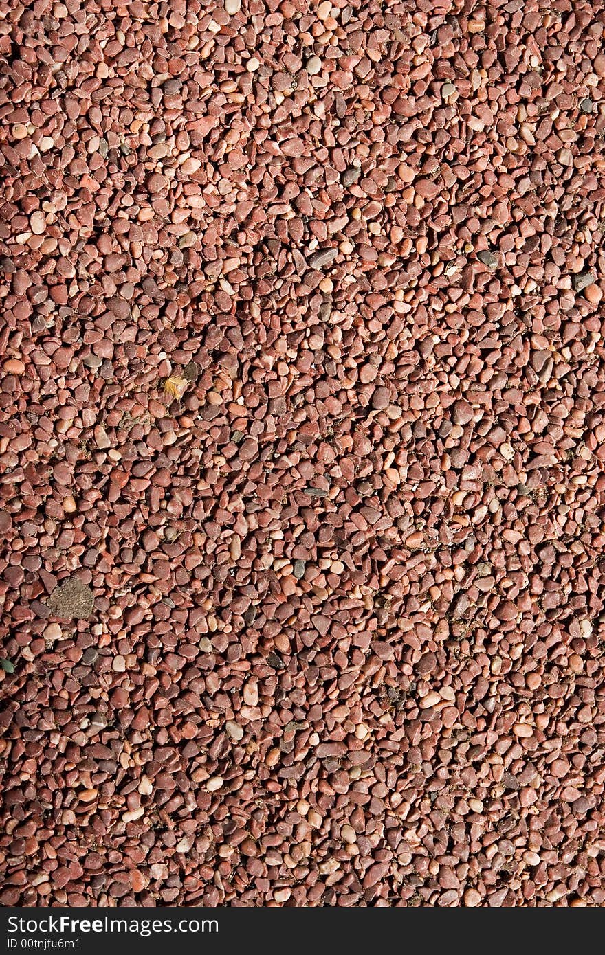 Red stone background shot from directly above parallel. Red stone background shot from directly above parallel
