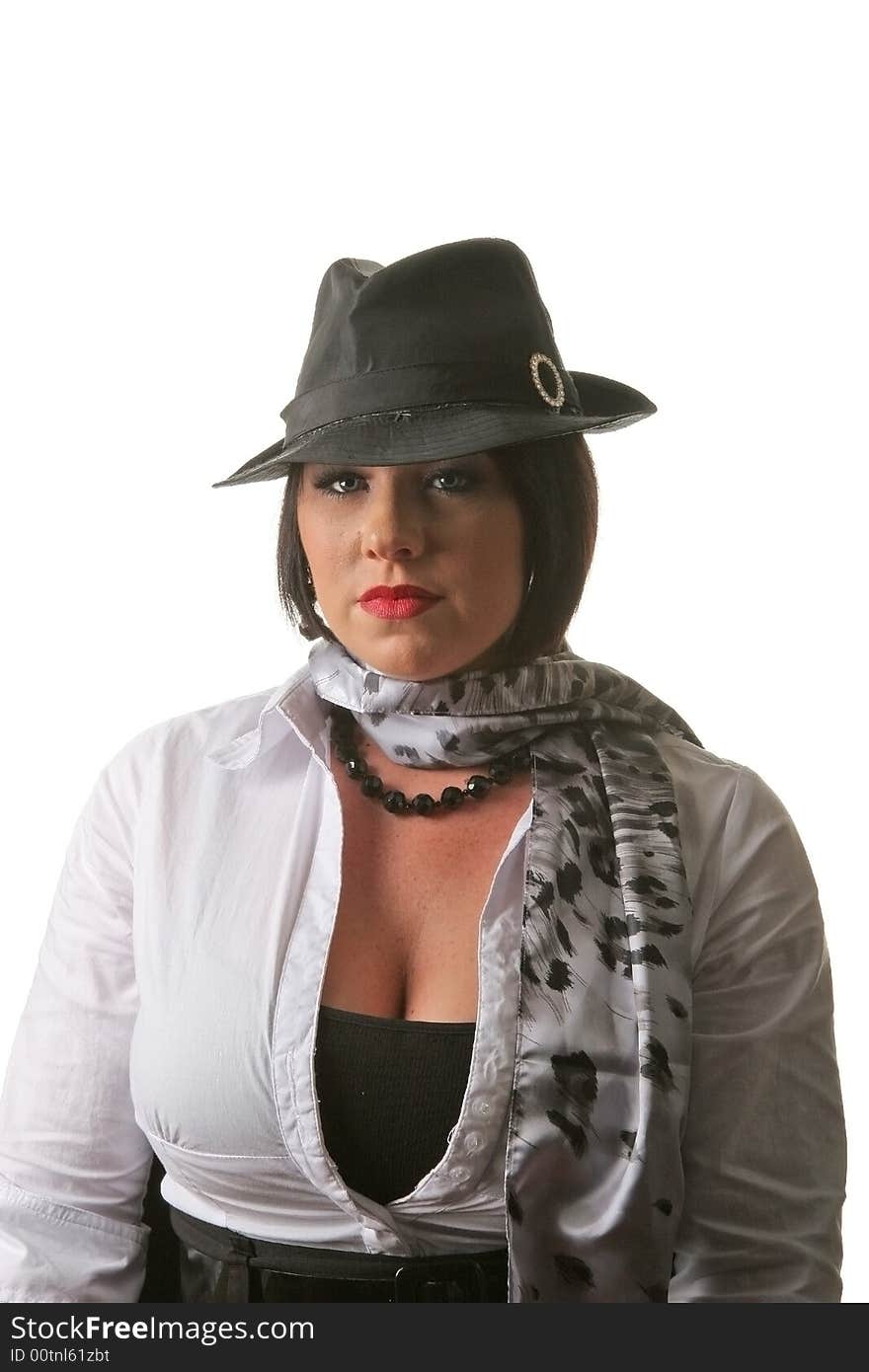 A black haired woman in black hat and white blouse on a white background. A black haired woman in black hat and white blouse on a white background