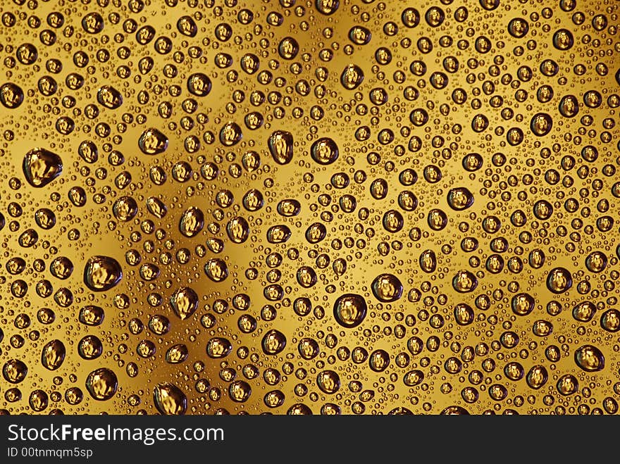 Water drops on the orange background