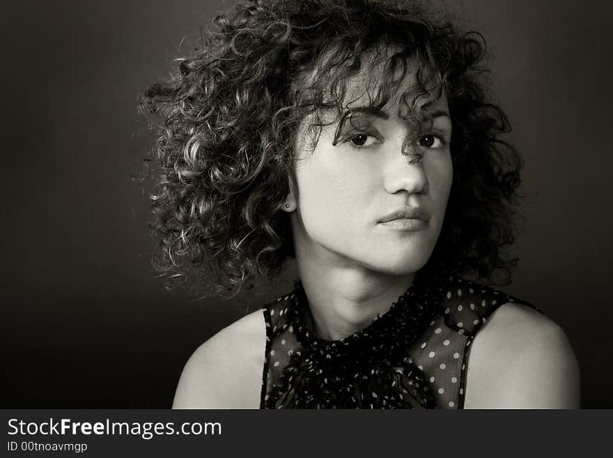 Portrait of a woman in a studion on a dark background