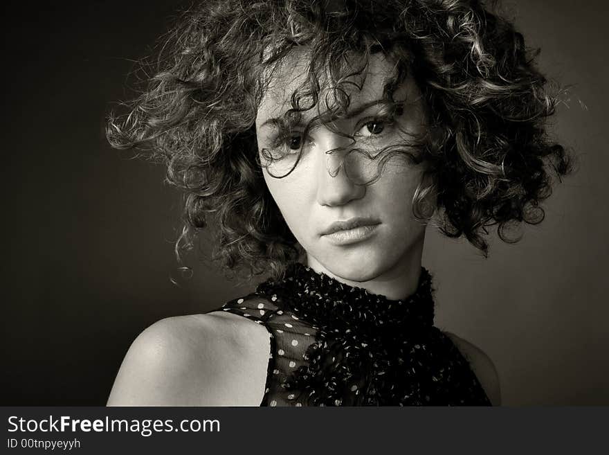 Portrait of a woman in studion on a dark background