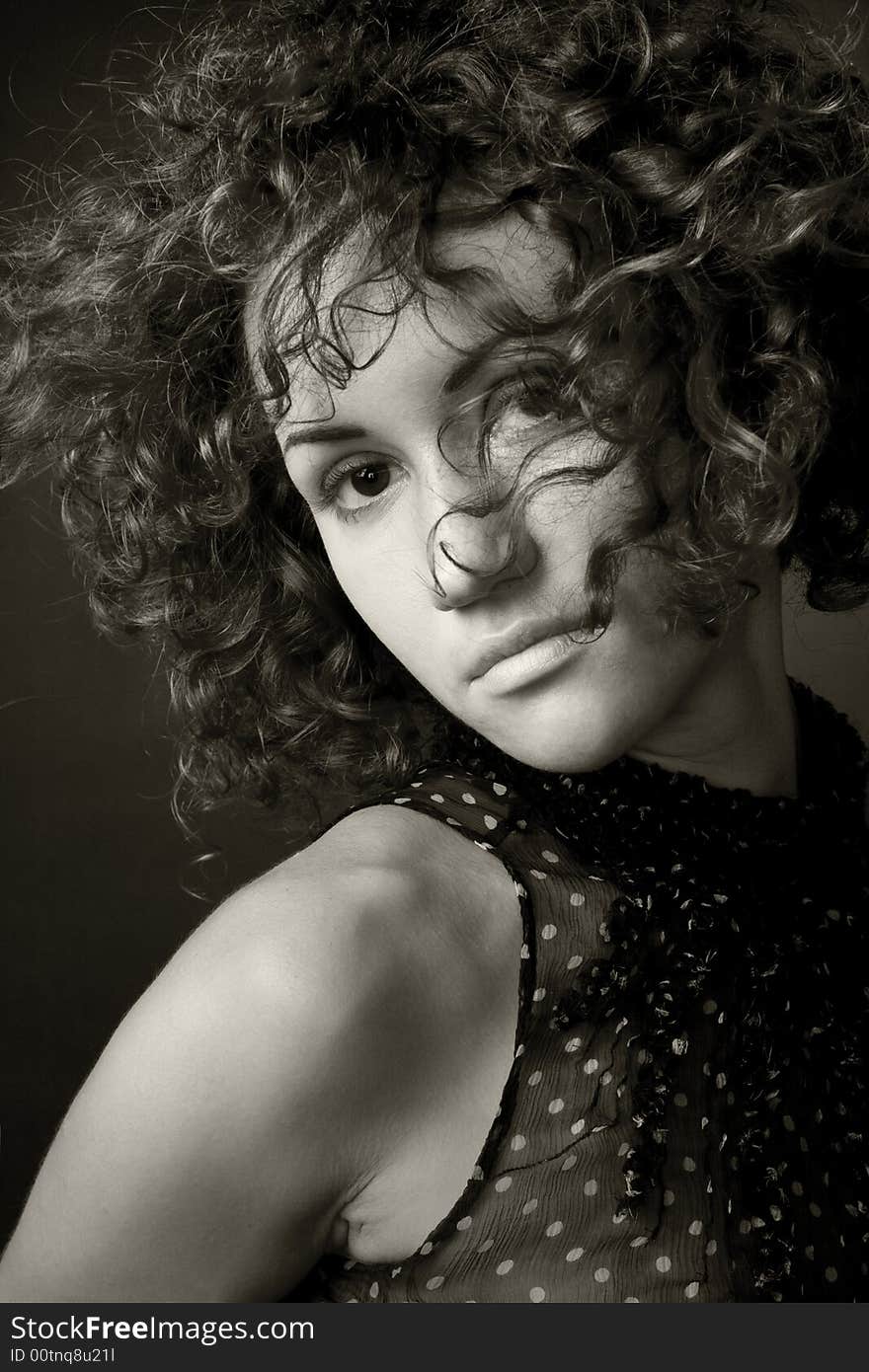 Portrait of a woman in a studion on dark background