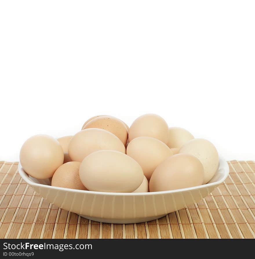 Eggs in a plate isolated on white background