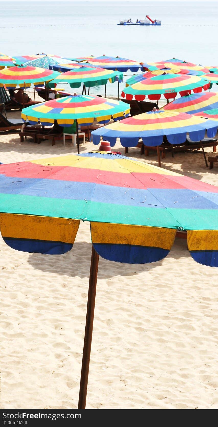 Beach umbrellas at the seaside on a summer day.