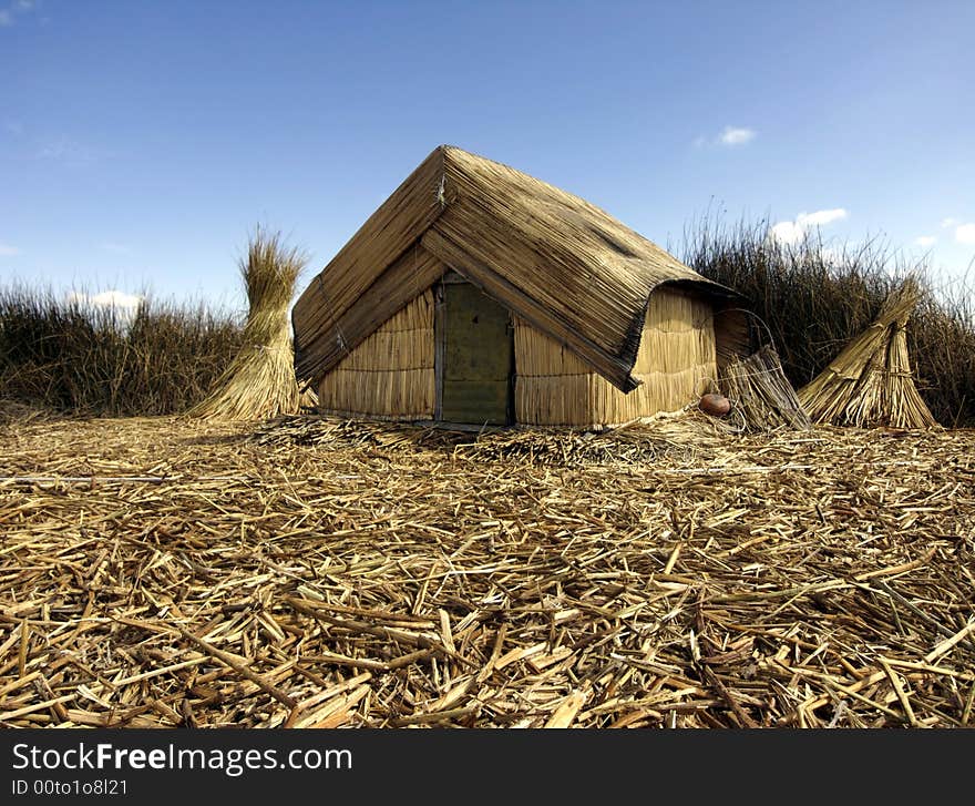 A reed house on the floating islands of Uros. A reed house on the floating islands of Uros.