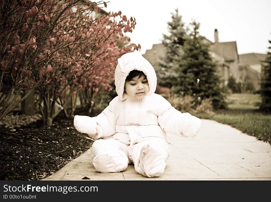 Picture of a child wearing snowsuit during winter. Picture of a child wearing snowsuit during winter