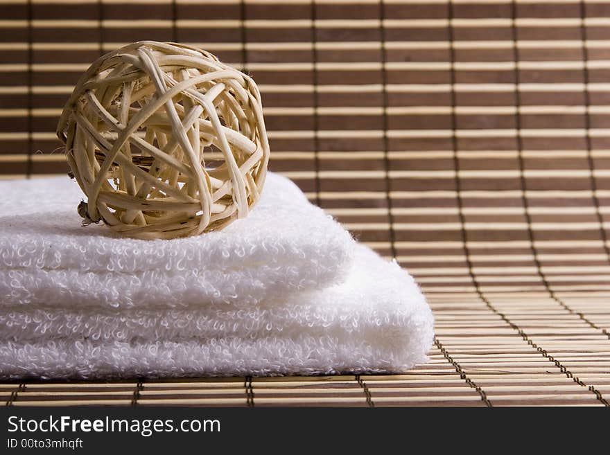 Two white towels on the desk and sphere