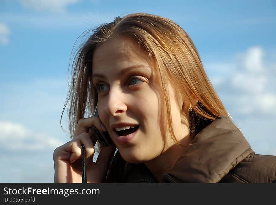 Pretty woman calling on phone outdoor