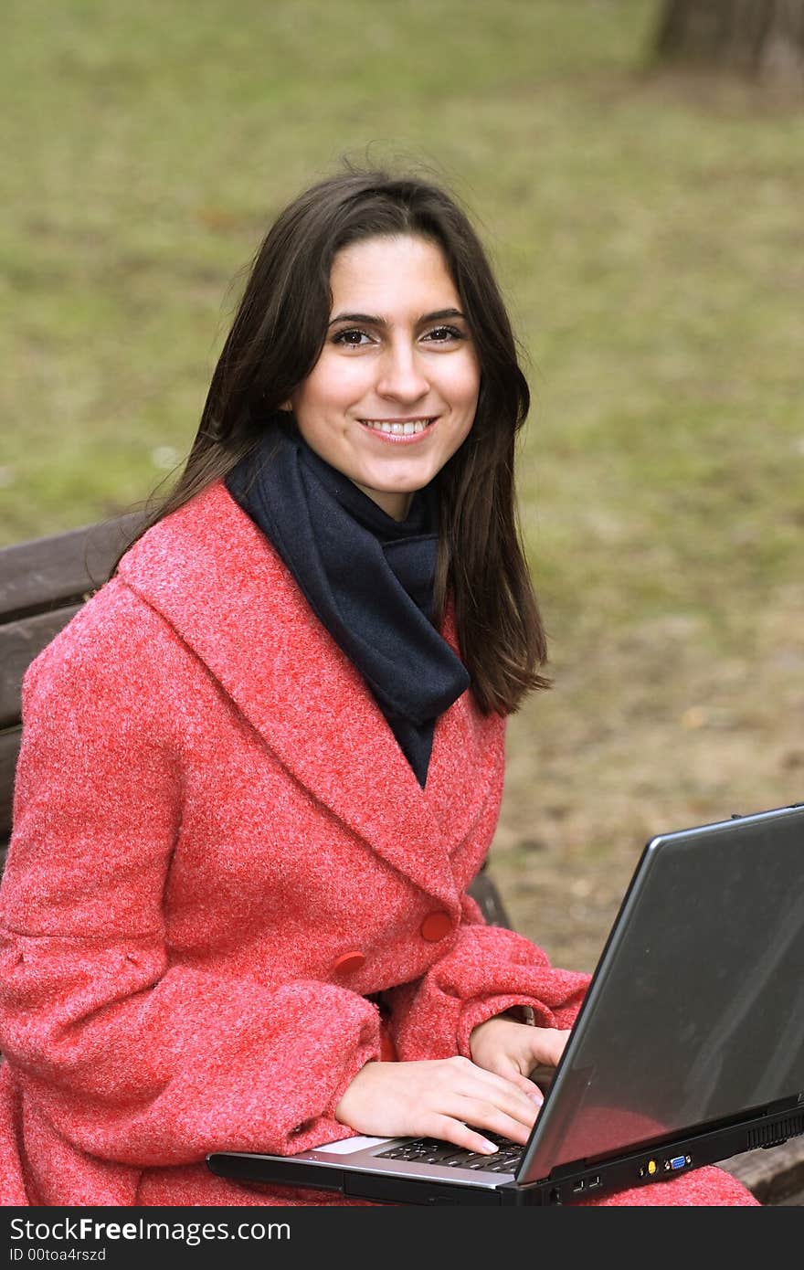 The girl laptop in spring park. The girl laptop in spring park