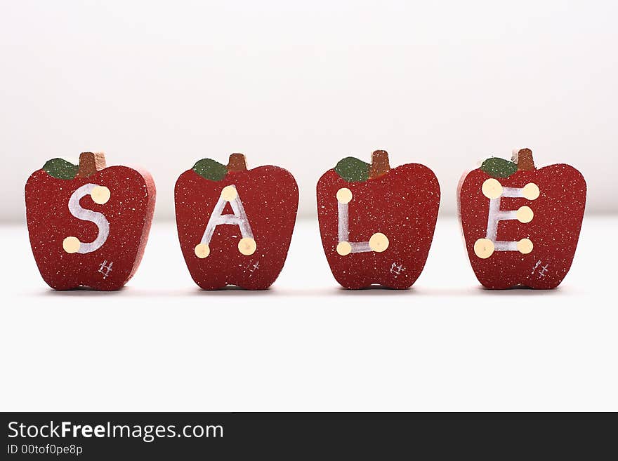 Wooden Apples with letterings spelling sale.